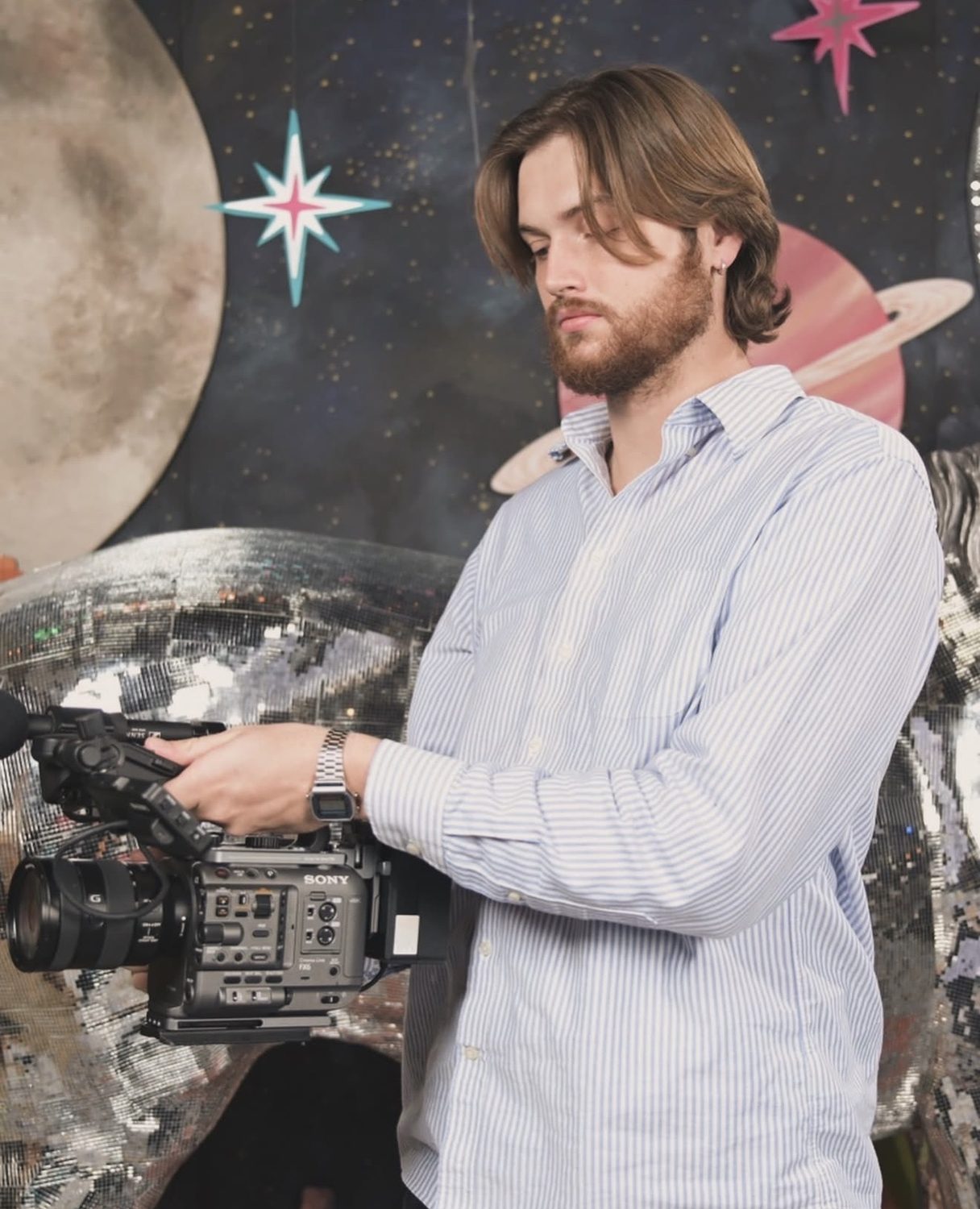 Nick Barker of CNB Creative holding a Sony FX6 cinema camera on set