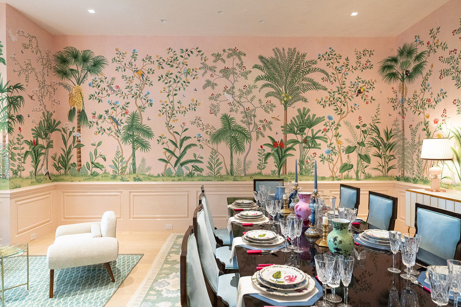 Hand-painted pink chinoiserie mural wrapping a formal dining room