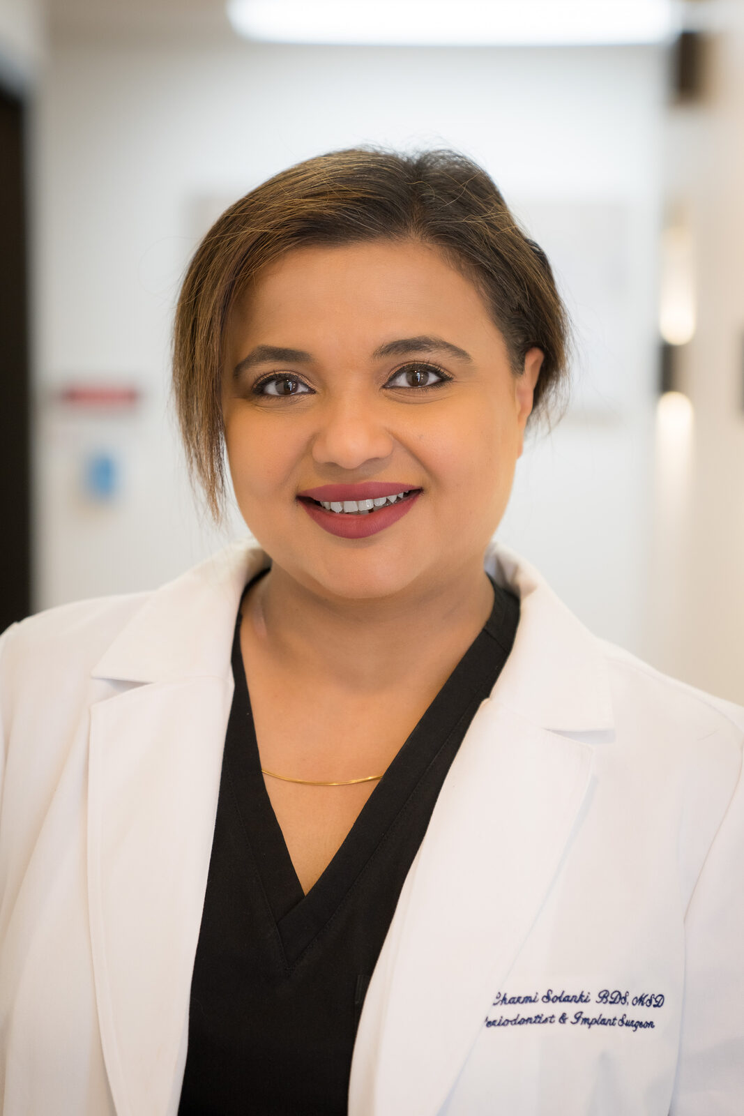 Periodontist in a white coat at Legacy Periodontics & Implant Center