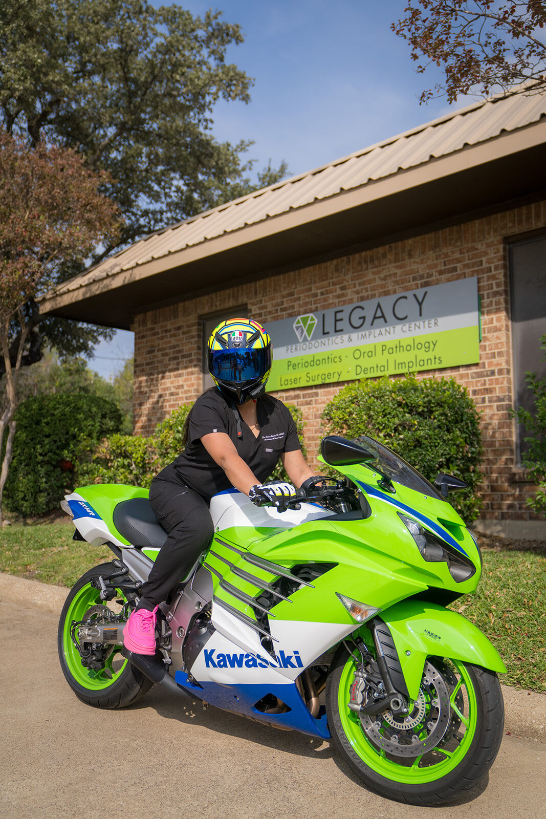 Periodontist on a sport motorcycle in riding gear