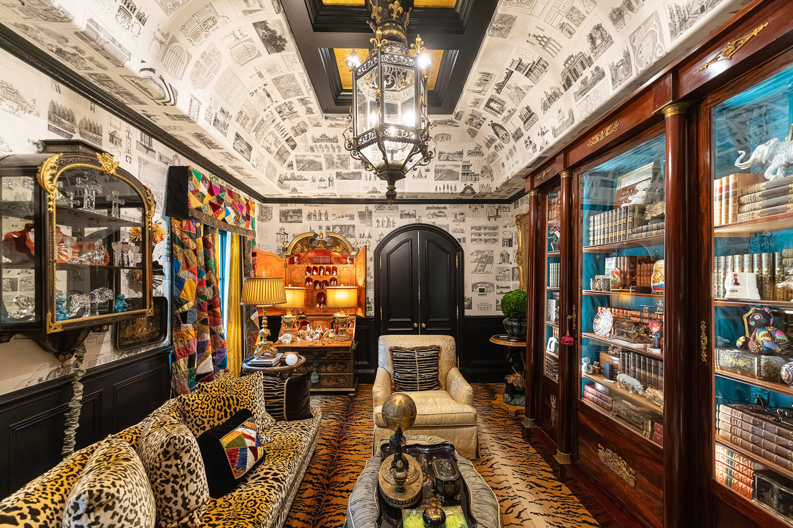 Maximalist study wrapped in black-and-white architectural prints