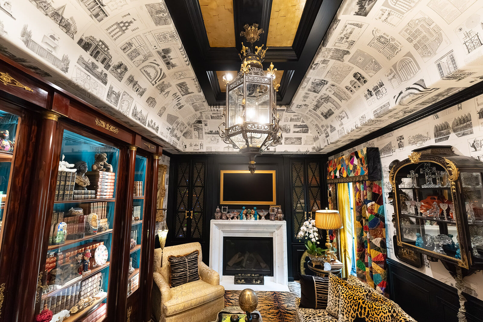 Print-room study with marble fireplace and leopard seating