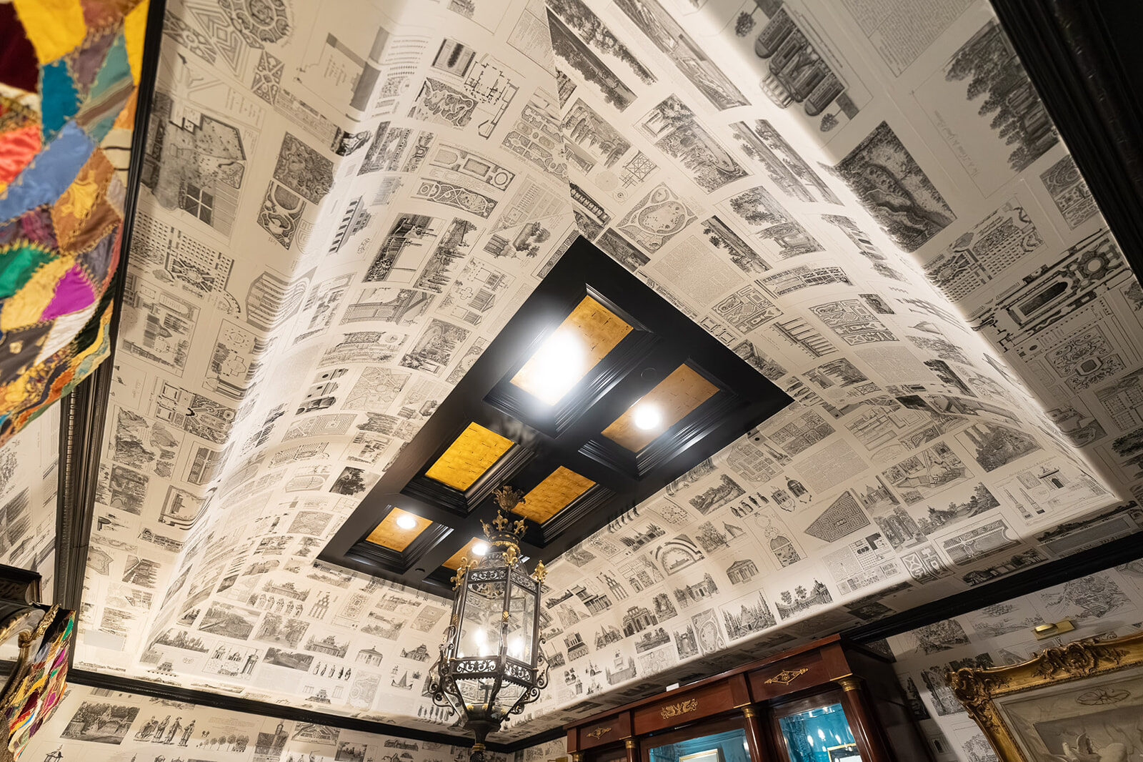 Barrel ceiling papered in antique architectural engravings