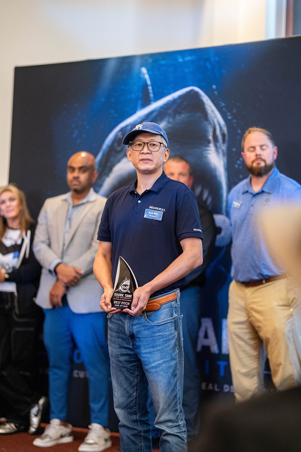 Best Pitch winner holding the SVIP Shark Tank trophy